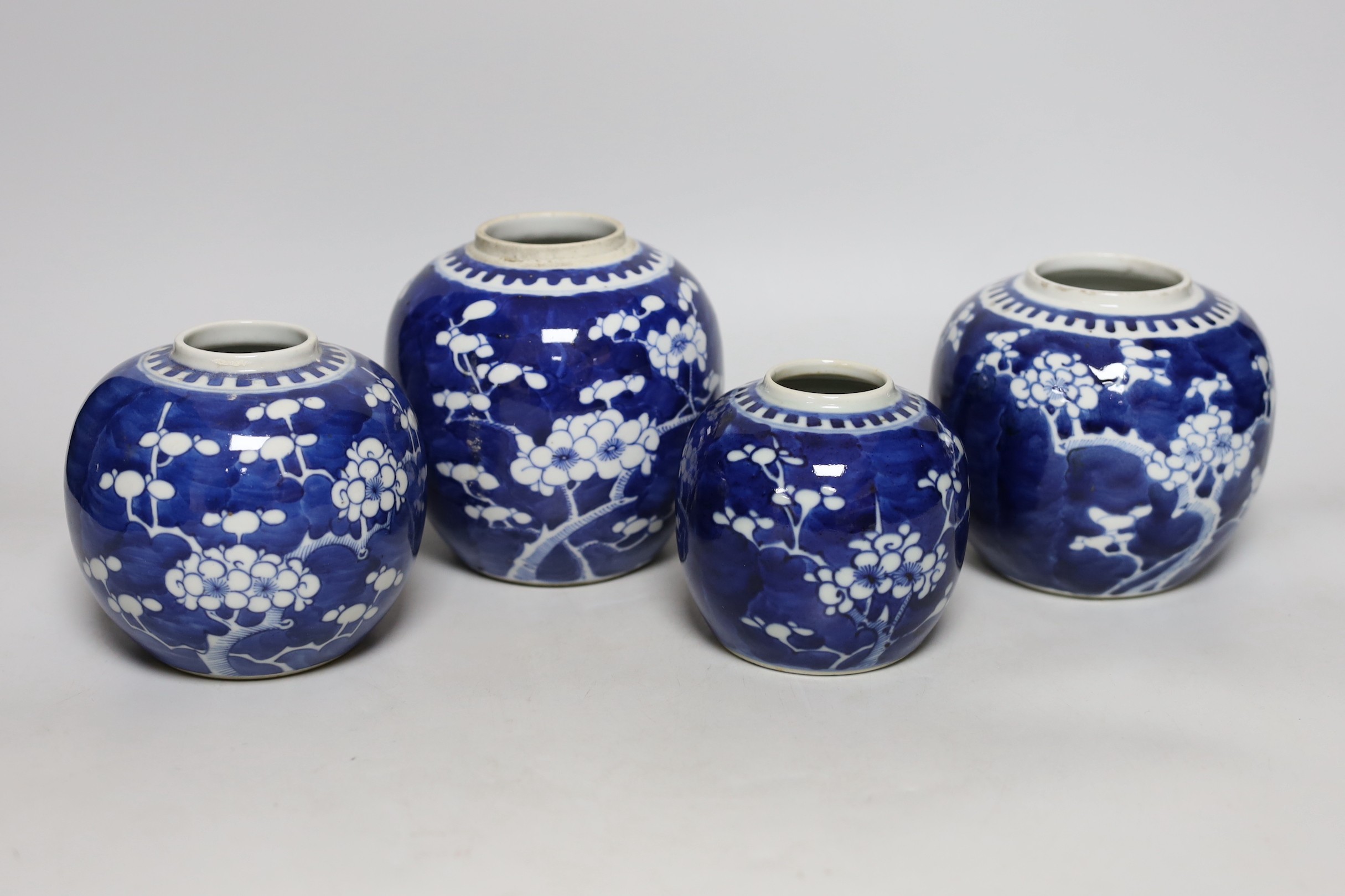 Four Chinese blue and white ‘prunus’ jars, tallest 14cms high